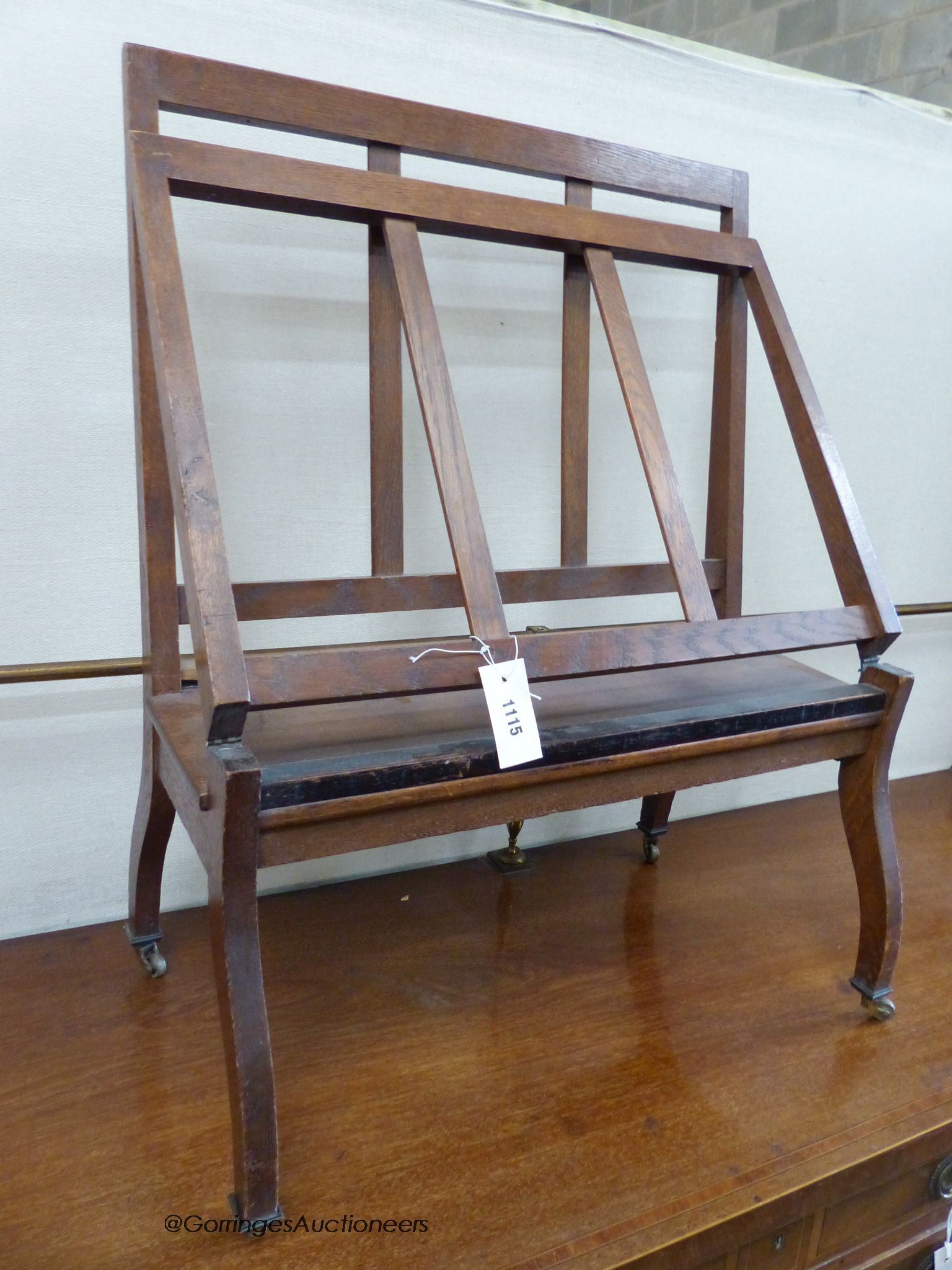 An oak folio stand, width 60cm depth 24cm height 76cm